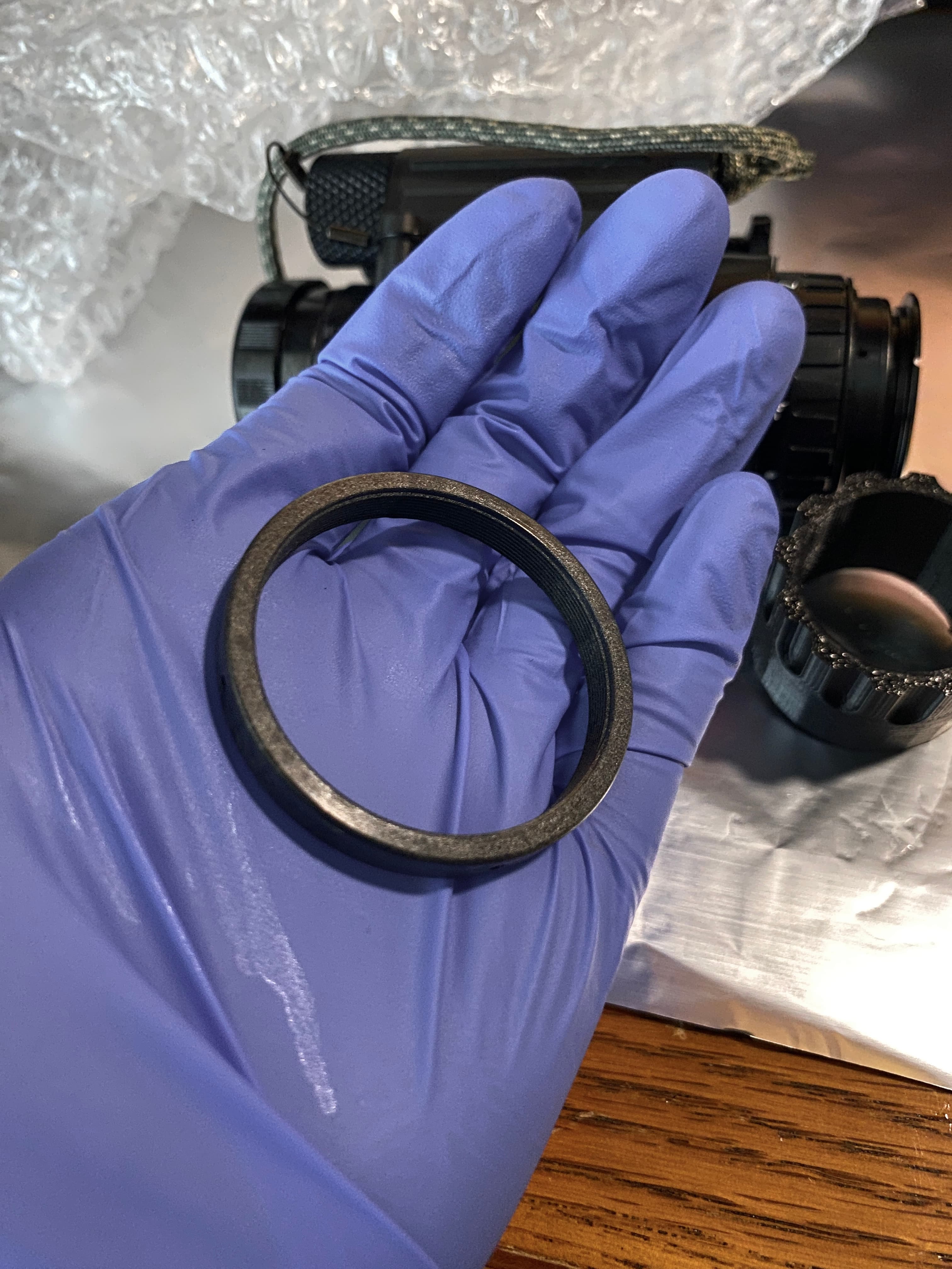 Working on a diopter lock ring at the bench