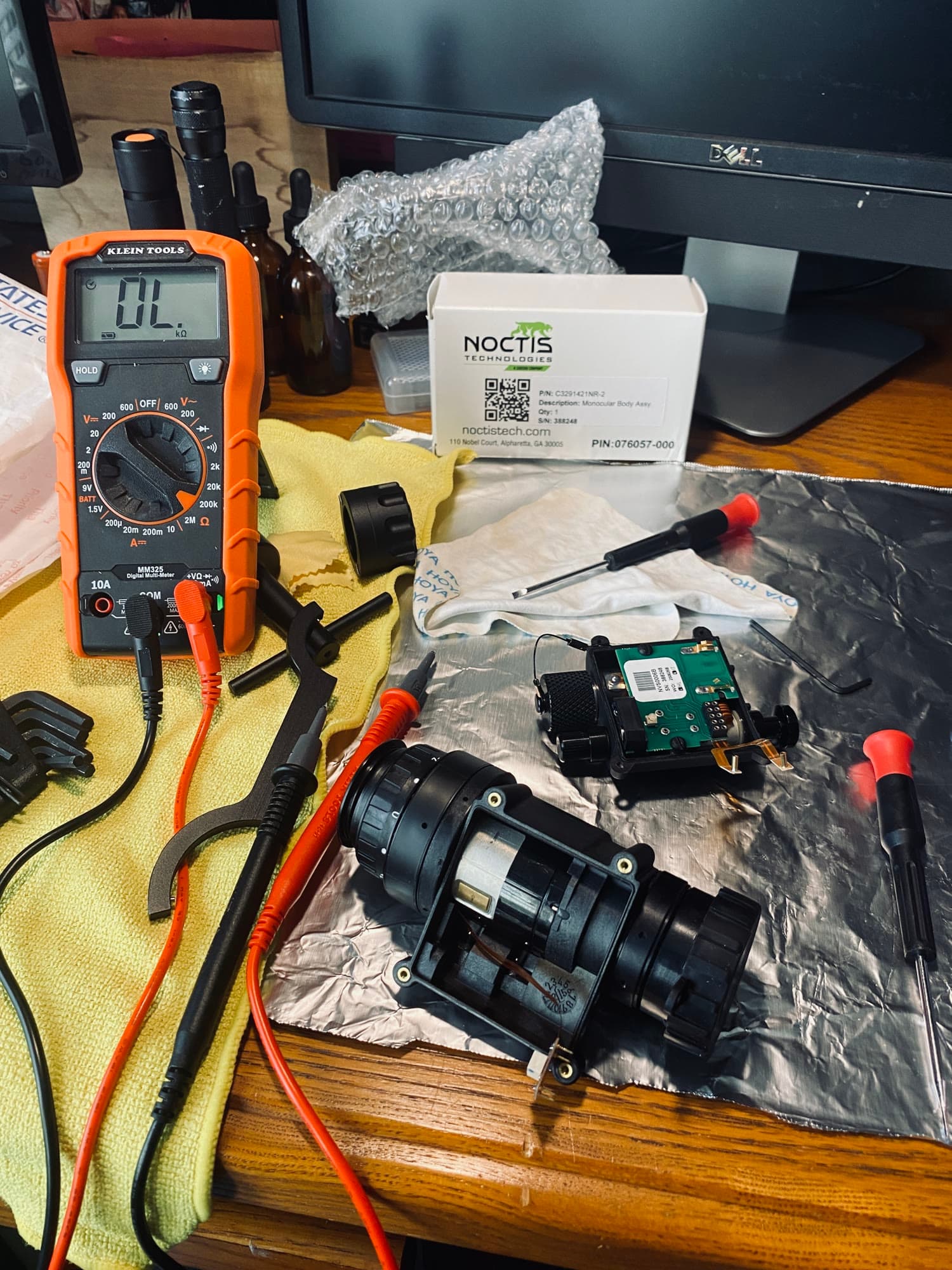 Bench teardown. Multimeter across the gain knob, pigtail pins, and ribbon cables to rule out the housing.